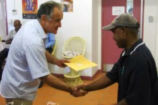 High Commissioner, Frank Ingruber, presents DAP recipient with a cheque.