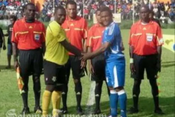 Opposing captains Jean-Robert Yelou, left, and Henry Fa'arodo exchange pleasantries before the match.