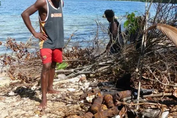Collecting empty Bomb Shells on Guadalcanal. Thousands of UXO’s littered parts of Solomon Islands after WWII.