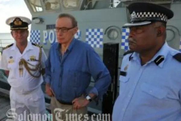 Senator Carr on one of the Patrol boats with Commander Geoff Turner (L) and Superintendent Russell Tagini (R).