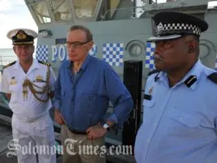 Senator Carr on one of the Patrol boats with Commander Geoff Turner (L) and Superintendent Russell Tagini (R).