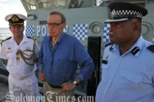 Senator Carr on one of the Patrol boats with Commander Geoff Turner (L) and Superintendent Russell Tagini (R).