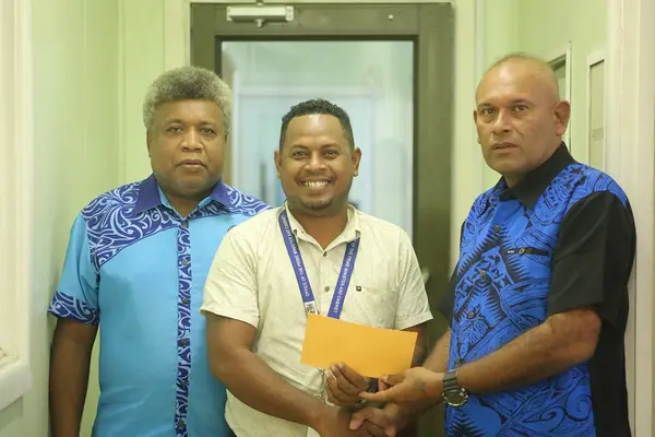 Isabel Premier Lesley Kikolo and his Secretary John Lokumana handing over total cash of SBD$135,000 to Chairman of the bushfire fundraising committee Dr. Derek Mane at the Prime Minister’s Office yesterday.