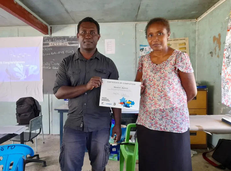 Teachers completed training to use the science teaching tools in the classroom. Catalpa’s Juliet Horihau presents Newton Banisi with a completion certificate.