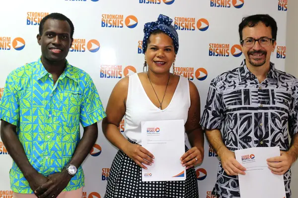 L - R: The Young Entrepreneurs Council Solomon Islands (YECSI) Coordinator, Emmanuel Pitakaka, Chairlady, Millicent Barty, Women’s Economic Empowerment and Youth Director at Strongim Bisnis, Mr Gianluca Nardi and after signing the partnership agreement to pursue the Youth Innovation Programme.