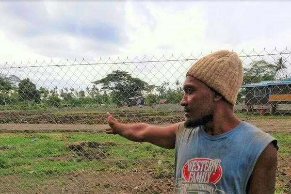 Eric points out the area where his house once stood.