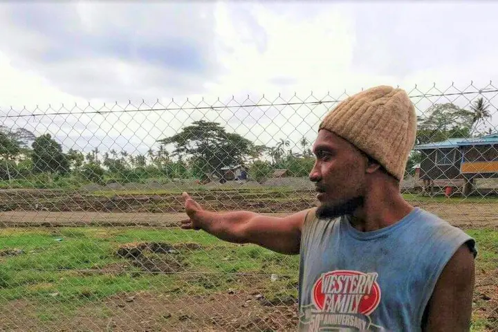 Eric points out the area where his house once stood.