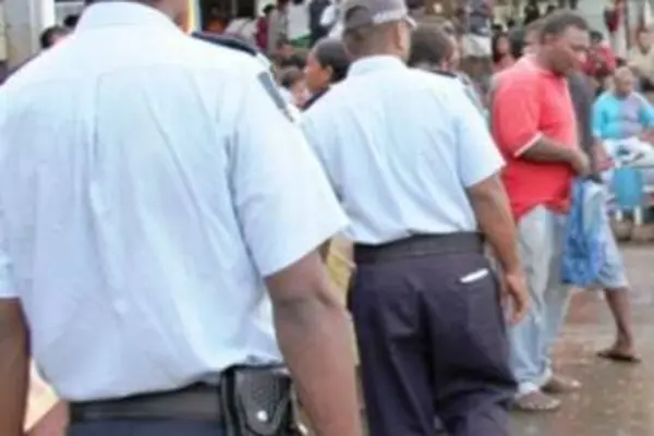 Police officers patrolling the Honiara central market yesterday.