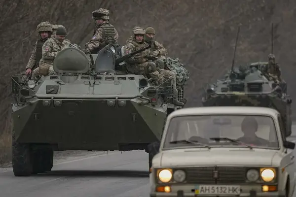 Russian President Vladimir Putin threatened any country trying to interfere with “consequences you have never seen,” as a once-hoped for diplomatic resolution now appeared impossible.