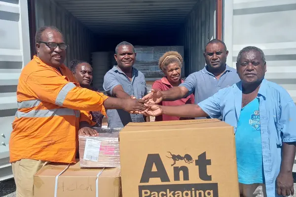 Cornelius Donga hands over the equipment to recipients.