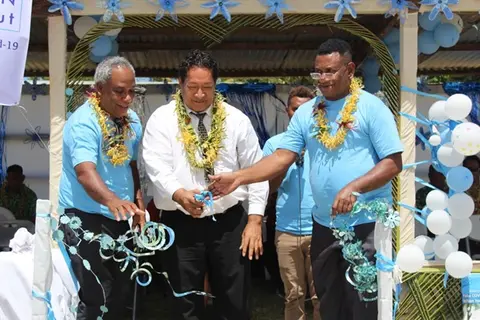 L-R Health Director George Pego, Premier Hon. Tuhagenga and National Director of Nursing Mr Michael Larui cutting ribbon to mark launch of the COVID-19 vaccination roll out.