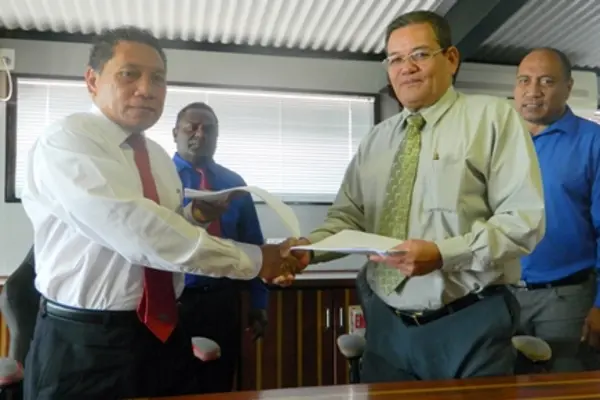 Solomon Islands Minister of Communication and Aviation, the Hon. Peter Shanel Agovaka (left front) and Republic of Kiribati Minister of Information, Communication, Transport and Tourism Development, the Hon. Willie Tokataake.