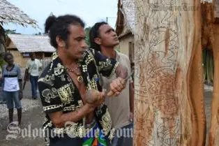 Te Pou Huke and Pau Hereveri from Rapa Nui (Easter Island) carve a totem pole.