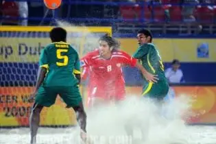 Rami Al Mesaabi of UAE holds off Hickly Rence (L) and Franco Nee of the Solomon Islands during the Group C FIFA Beach Soccer World Cup match between Solomon Islands and UAE.
