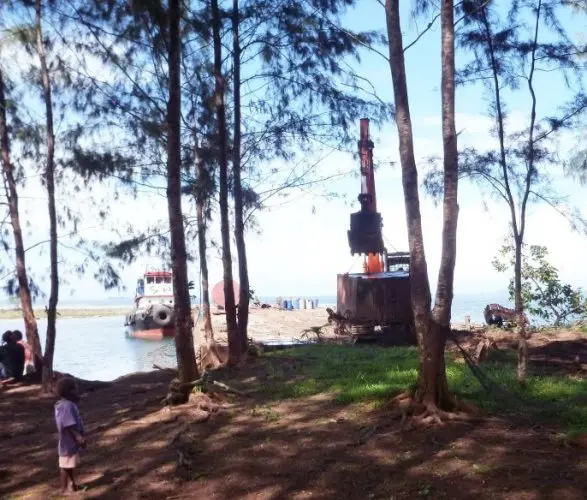 A Barge landing onto a community wharf in Kolobangara in the Western Solomon Islands.