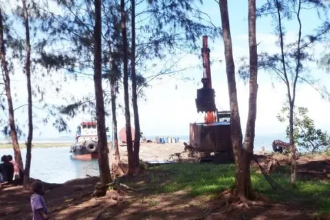 A Barge landing onto a community wharf in Kolobangara in the Western Solomon Islands.