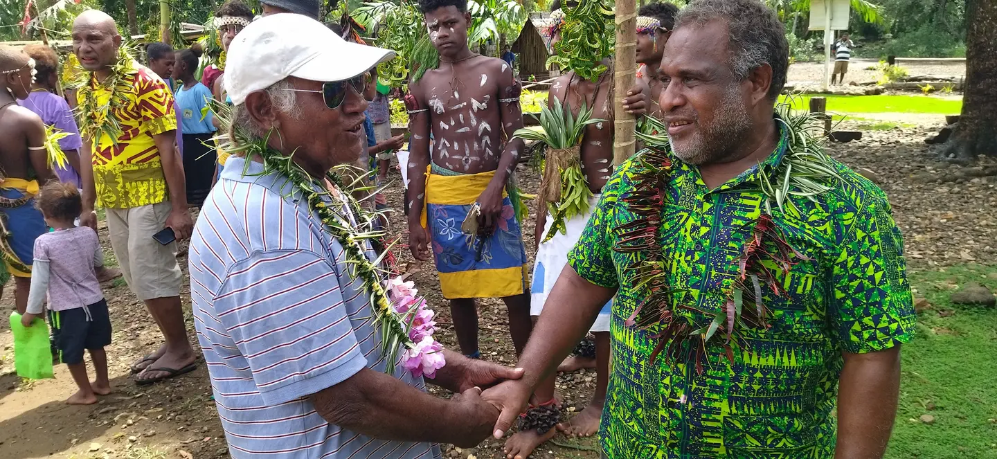 Mr. Chanel Iroi (R), the SGP's National Steering Committee Chairperson and the Deputy Secretary-Technical for the Ministry of Environment, Climate Change, Disaster Management and Meteorology (MECDM), acknowledged the community’s hard work and the successful implementation of the project.