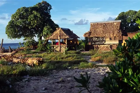 Tidal gauges indicate the world's oceans have been rising at an annual rate of 3.2 millimetres (0.1 inches) since 1970. Many scientists expect that rate to accelerate and for climate change to trigger more intense storms, which may pose an even more pressing threat to many of the world's low-lying islands.