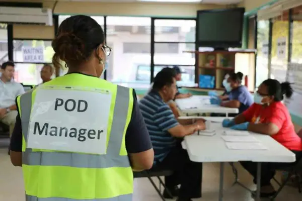 Health workers give Palau citizens their first dose of the Moderna COVID-19 vaccination.
