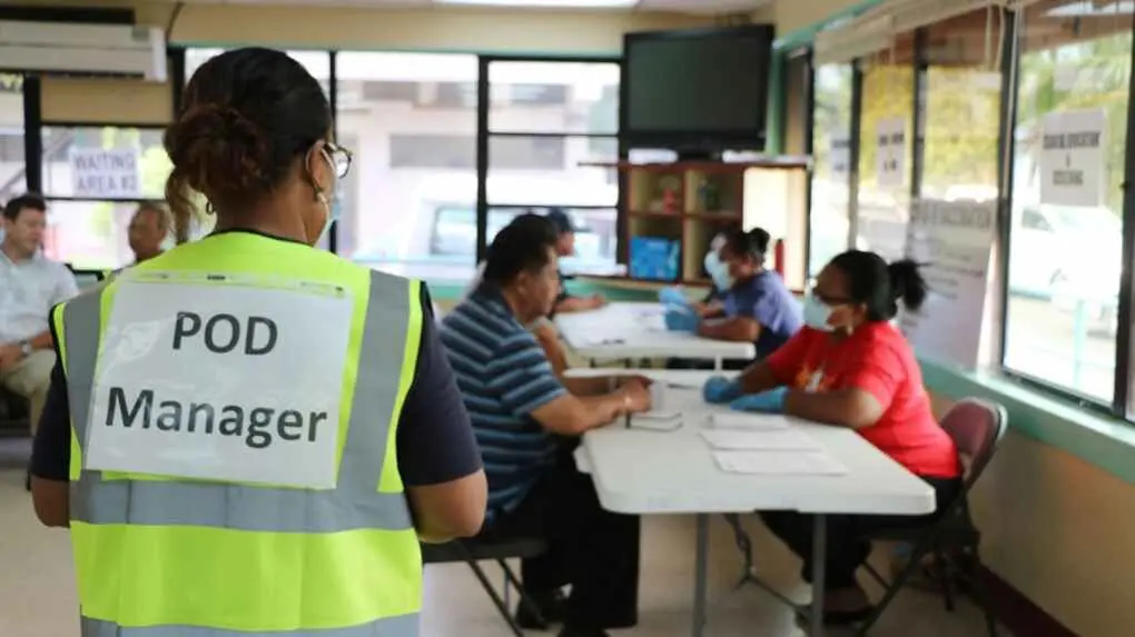 Health workers give Palau citizens their first dose of the Moderna COVID-19 vaccination.