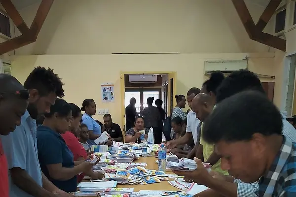 Combined efforts by MHMS and partners sorting out Covid-19 awareness materials before going to the field.