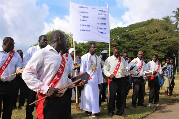 Deacon Clement Netana being accompanied by the South Seas Evangelical Church (SSEC) men’s matching band during the ordination program.